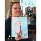 Person holding a painting of an owl with colorful decorations and text overlay.